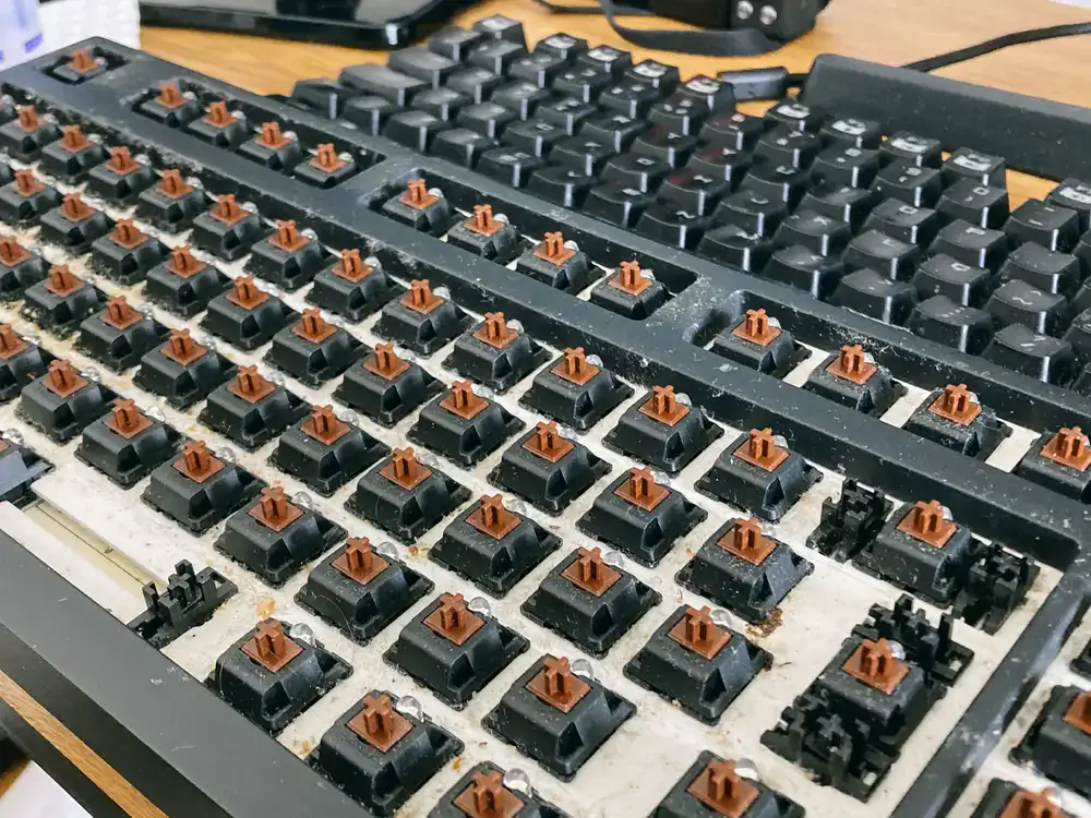 Cleaning and repairing tactile buttons