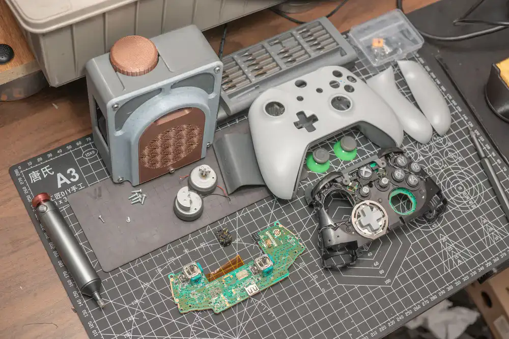 Technician working on a disassembled retro console
