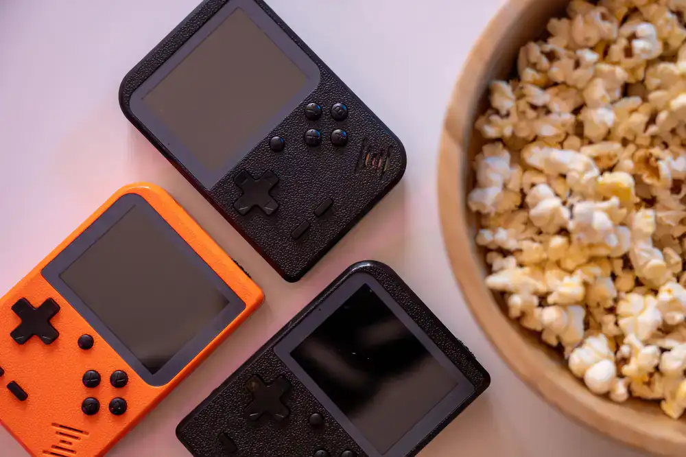 Top-down view of a colorful retro handheld console